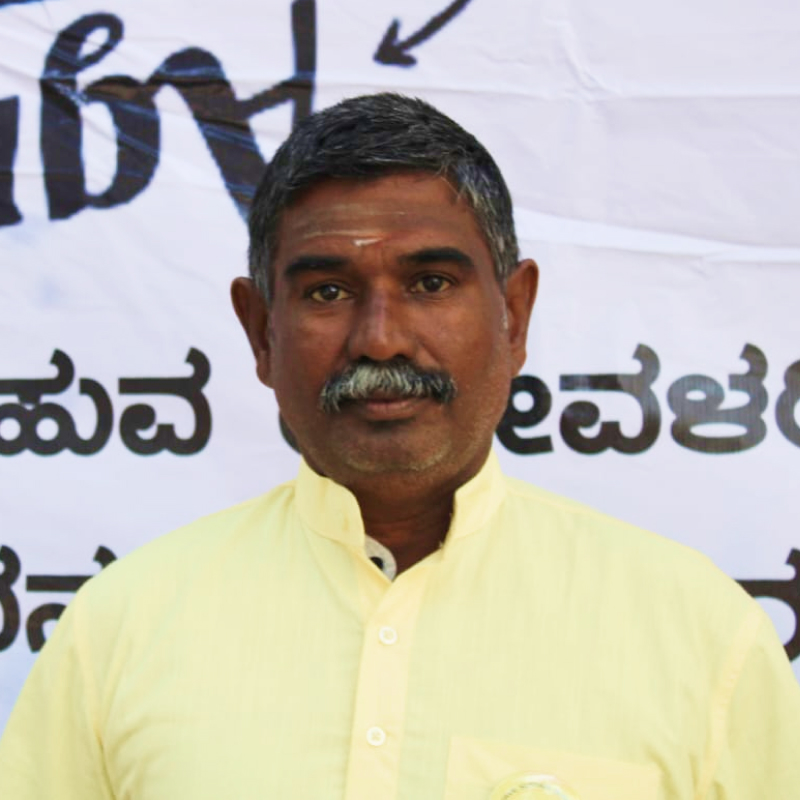 A profile picture of a farmer Periyasamy.